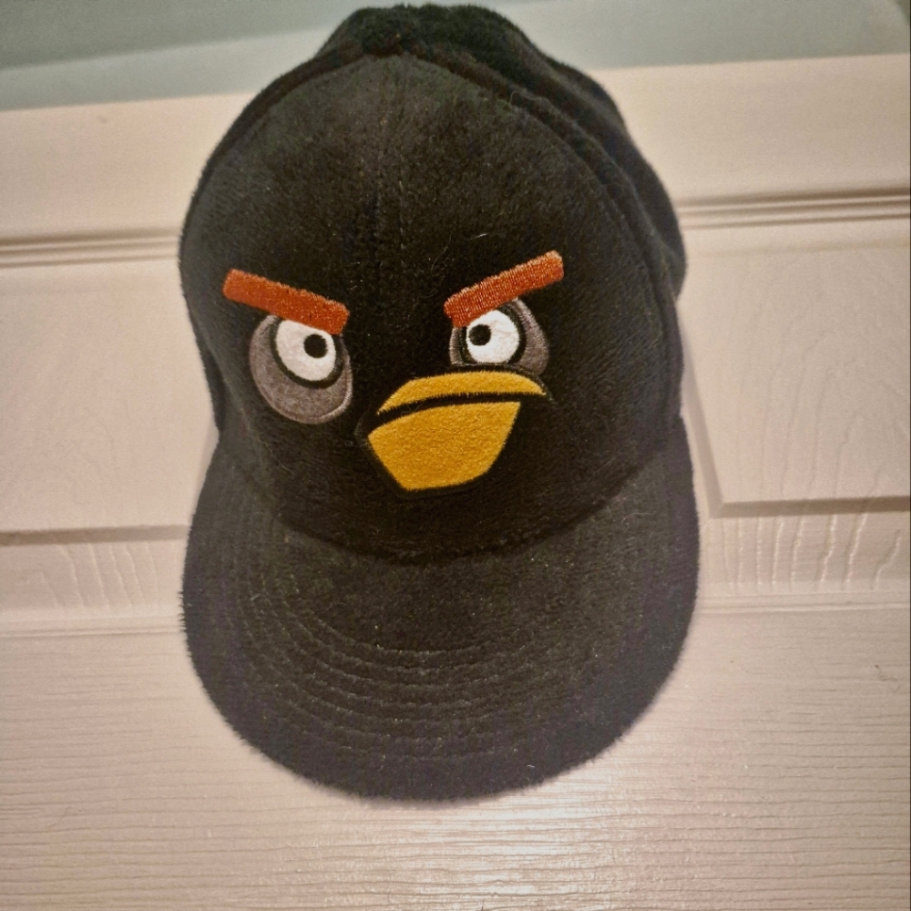 NWOT Angry Birds baseball hat. Vibrant graphics against a soft black background.